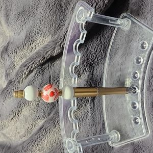 Handmade decorative butterfly beaded pen. Includes pouch.